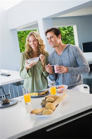simsearch:6108-05864945,k - Couple at the breakfast table Stock Photo - Premium Royalty-Free, Code: 6108-05863262