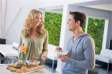 simsearch:6108-05861651,k - Couple at the breakfast table Stock Photo - Premium Royalty-Free, Code: 6108-05863267