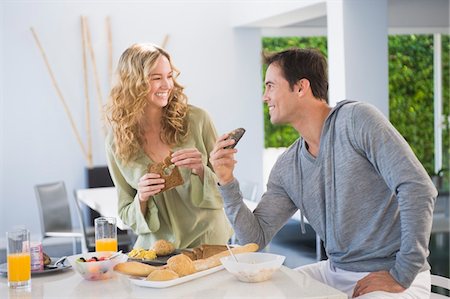 simsearch:6108-05861651,k - Couple at the breakfast table Stock Photo - Premium Royalty-Free, Code: 6108-05863269