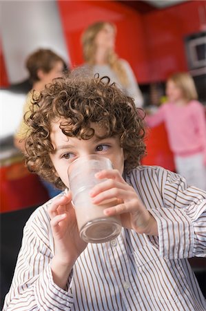 simsearch:6108-07969525,k - Close-up of a boy drinking a glass of milk Stock Photo - Premium Royalty-Free, Code: 6108-05863453