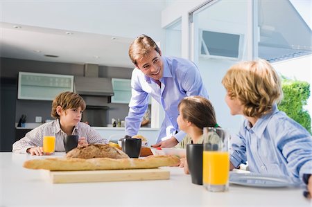 simsearch:6108-05864945,k - Family at the breakfast table Stock Photo - Premium Royalty-Free, Code: 6108-05863457