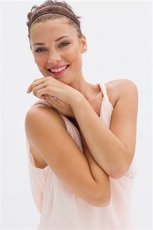 pink silk - Portrait of a fashion model smiling Stock Photo - Premium Royalty-Free, Code: 6108-05864356