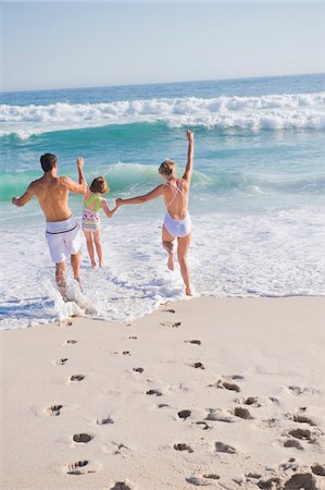 sea group fun - Family enjoying vacations on the beach Stock Photo - Premium Royalty-Free, Code: 6108-05865150