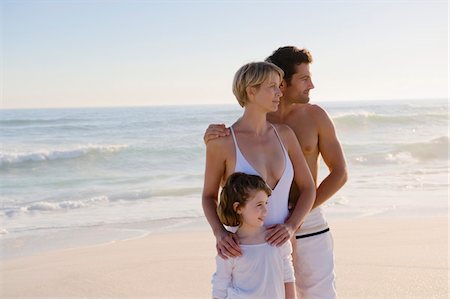 Family standing on the beach Stock Photo - Premium Royalty-Free, Code: 6108-05865206