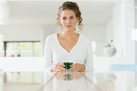 simsearch:6108-05864945,k - Woman holding a glass of pea soup Stock Photo - Premium Royalty-Free, Code: 6108-05865452