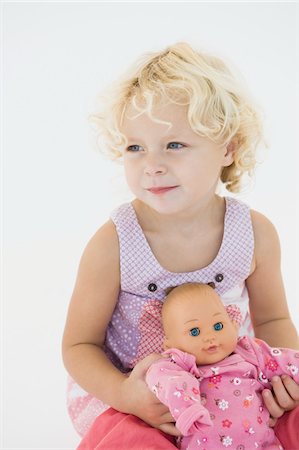 simsearch:6108-05865577,k - Girl holding a doll Stock Photo - Premium Royalty-Free, Code: 6108-05865585