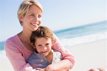 Family enjoying vacations on the beach Stock Photo - Premium Royalty-Free, Code: 6108-05865988