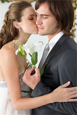 Bride kissing groom Stock Photo - Premium Royalty-Free, Code: 6108-05866264