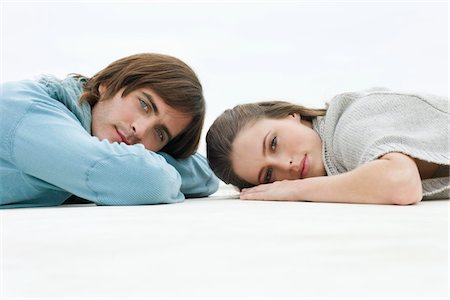 simsearch:6108-05859747,k - Couple lying on the floor Stock Photo - Premium Royalty-Free, Code: 6108-05866210