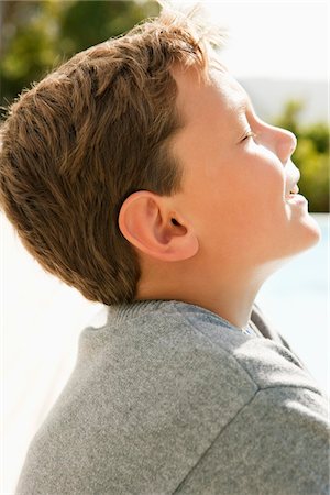 simsearch:6108-05859747,k - Close-up of a boy day dreaming Stock Photo - Premium Royalty-Free, Code: 6108-05866396