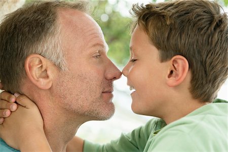 Man and his son rubbing noses Stock Photo - Premium Royalty-Free, Code: 6108-05866457