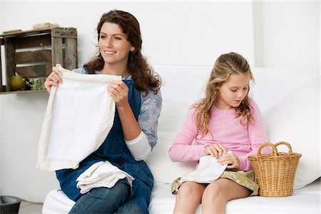 simsearch:6108-05860153,k - Woman and her daughter holding pillow covers Stock Photo - Premium Royalty-Free, Code: 6108-05866434