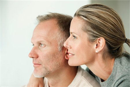 emotional woman looking away - Close-up of a couple day dreaming Stock Photo - Premium Royalty-Free, Code: 6108-05866667