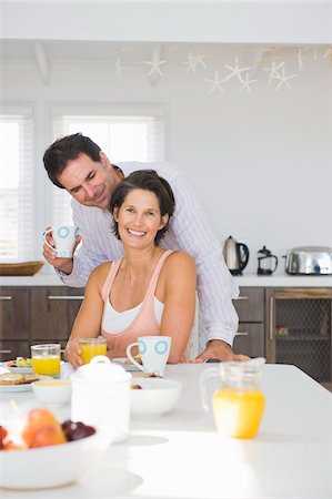 simsearch:6108-05861651,k - Couple having breakfast Stock Photo - Premium Royalty-Free, Code: 6108-05866698
