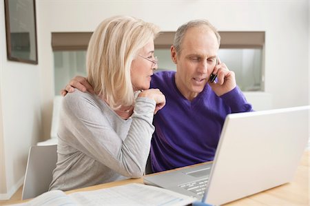 senior women chat - Couple sitting together in front of a laptop Stock Photo - Premium Royalty-Free, Code: 6108-05867356