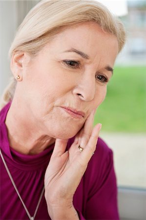 simsearch:6108-06167824,k - Close-up of a woman suffering from a toothache Stock Photo - Premium Royalty-Free, Code: 6108-05867305