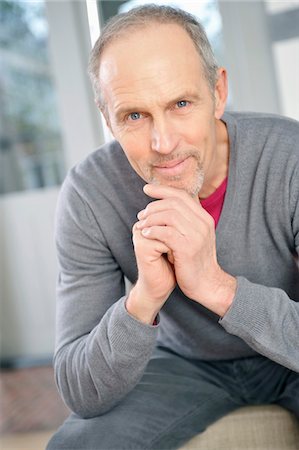 Portrait of a man smiling Stock Photo - Premium Royalty-Free, Code: 6108-05867479