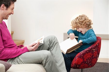 father son study - Man and his son reading books Stock Photo - Premium Royalty-Free, Code: 6108-05867508