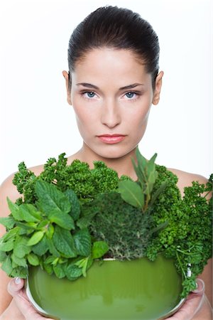 parsley - Young woman holding fresh herbs Stock Photo - Premium Royalty-Free, Code: 6108-05869143