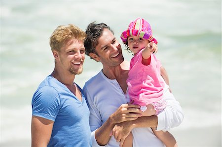 Man carrying his daughter pointing Stock Photo - Premium Royalty-Free, Code: 6108-05869624