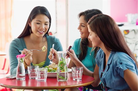 simsearch:6108-06906790,k - Three women eating food in a restaurant Stock Photo - Premium Royalty-Free, Code: 6108-05869856