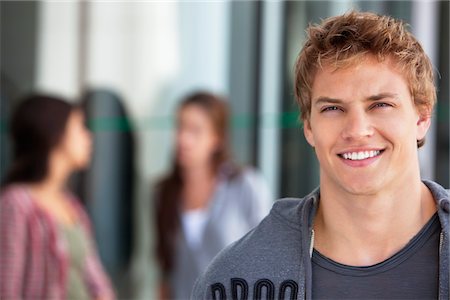 student (male) - Portrait of a man smiling in a campus Stock Photo - Premium Royalty-Free, Code: 6108-05869897