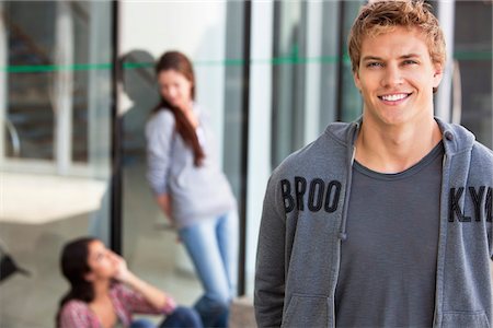 student (male) - Portrait of a man smiling in a campus Stock Photo - Premium Royalty-Free, Code: 6108-05869903