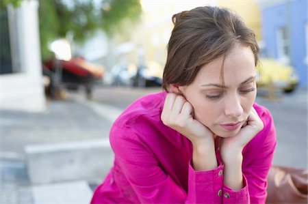 south africa street - Depressed young woman sitting at the roadside Stock Photo - Premium Royalty-Free, Code: 6108-05870260