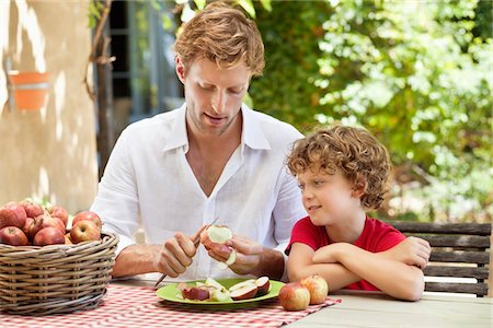 simsearch:649-05656972,k - Father peeling apple with son Stock Photo - Premium Royalty-Free, Code: 6108-05870666
