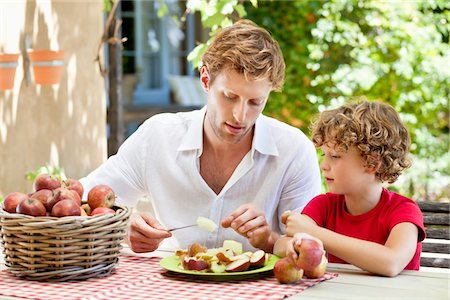 simsearch:649-05656972,k - Father peeling apple with son Stock Photo - Premium Royalty-Free, Code: 6108-05870673