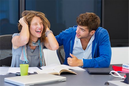 friend console - University student consoling his friend in a classroom Stock Photo - Premium Royalty-Free, Code: 6108-05871271