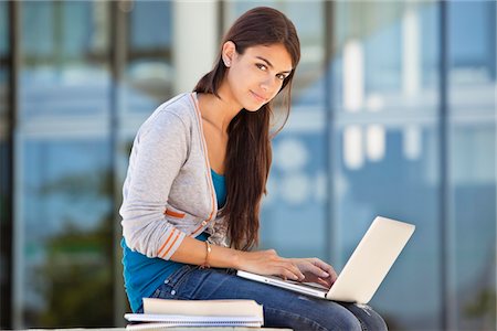 Portrait of a woman using a laptop Stock Photo - Premium Royalty-Free, Code: 6108-05871326