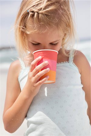 simsearch:6108-07969525,k - Girl drinking from disposable glass Stock Photo - Premium Royalty-Free, Code: 6108-05871561
