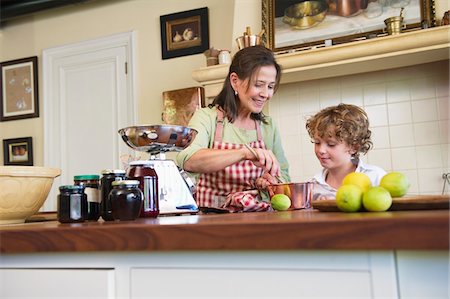 Grandmother and little boy cooking food at kitchen Stock Photo - Premium Royalty-Free, Code: 6108-05871803