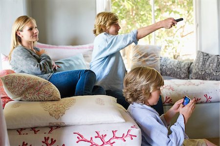 simsearch:6108-05872072,k - Children and mother using electronic gadgets at house Stock Photo - Premium Royalty-Free, Code: 6108-05872036
