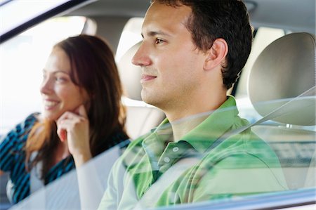 driving car side - Happy couple driving a car Stock Photo - Premium Royalty-Free, Code: 6108-05872179