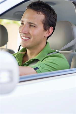 simsearch:6108-06906290,k - Smiling mid adult man driving a car Stock Photo - Premium Royalty-Free, Code: 6108-05872196