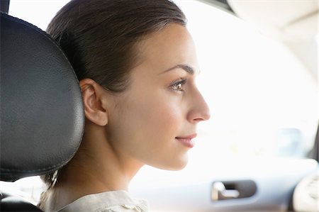 Young woman driving a car Stock Photo - Premium Royalty-Free, Code: 6108-05872199