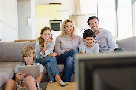 simsearch:6108-05872043,k - Family watching TV together at home Stock Photo - Premium Royalty-Free, Code: 6108-05872105