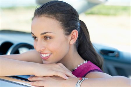 simsearch:6108-06906290,k - Beautiful young woman leaning on car window Stock Photo - Premium Royalty-Free, Code: 6108-05872230
