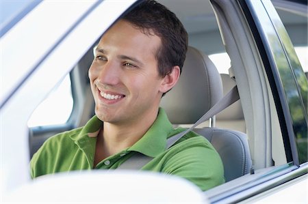 driver seat - Smiling mid adult man driving a car Stock Photo - Premium Royalty-Free, Code: 6108-05872237