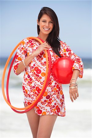 simsearch:6108-05872432,k - Portrait of a young woman carrying ball and plastic hoops Stock Photo - Premium Royalty-Free, Code: 6108-05872427