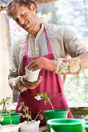 plantation - Man gardening and smiling Stock Photo - Premium Royalty-Free, Code: 6108-05872602