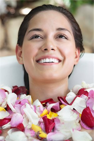 simsearch:6108-05872743,k - Beautiful young woman relaxing in bathtub with petals Stock Photo - Premium Royalty-Free, Code: 6108-05872739