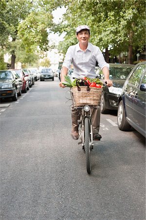 paris roads - Man carrying vegetables on a bicycle, Paris, Ile-de-France, France Stock Photo - Premium Royalty-Free, Code: 6108-05872840