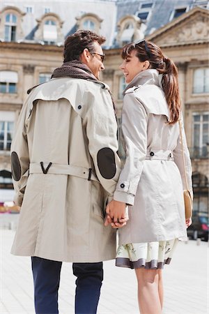 Couple walking on a street, Paris, Ile-de-France, France Stock Photo - Premium Royalty-Free, Code: 6108-05872851