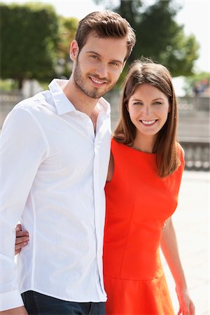 romance in paris - Couple walking with arms around and smiling, Paris, Ile-de-France, France Stock Photo - Premium Royalty-Free, Code: 6108-05872945