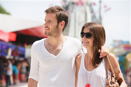 Man walking with his arm around a woman, Paris, Ile-de-France, France Stock Photo - Premium Royalty-Free, Code: 6108-05873107