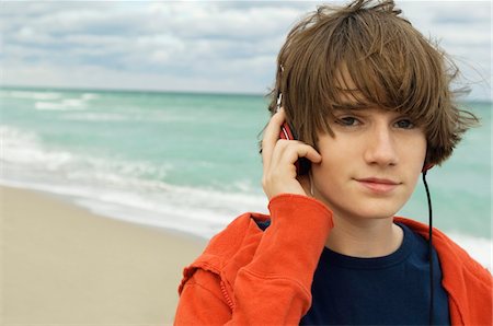 red music - Portrait of a boy listening to headphones Stock Photo - Premium Royalty-Free, Code: 6108-05873689