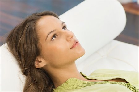 Woman lying on the bed Stock Photo - Premium Royalty-Free, Code: 6108-05873779